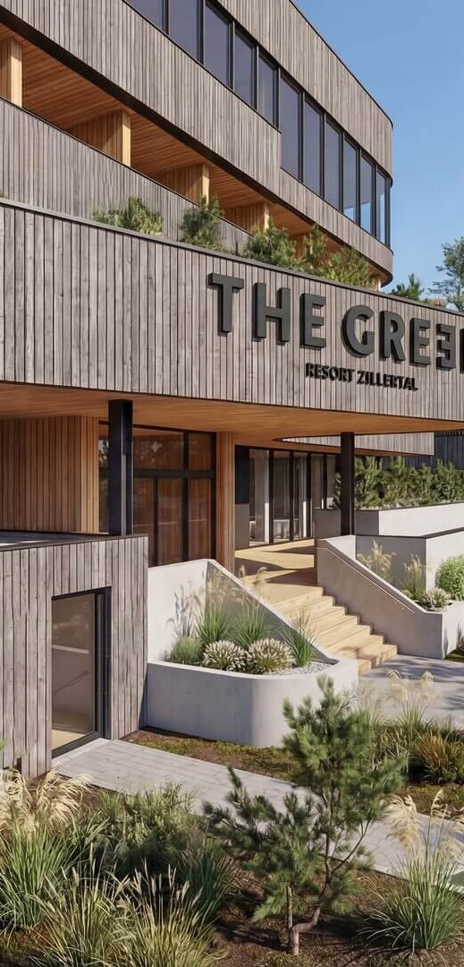 Eingangsbereich eines modernen Gebäudes mit Holzfassade und dem Schriftzug 'THE GREEN'
