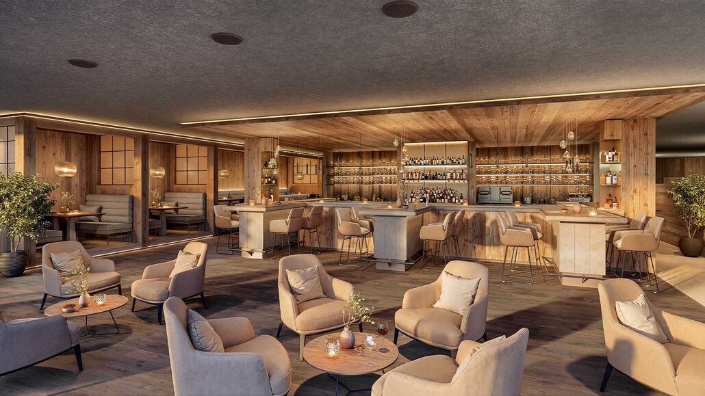Moderne Bar mit Holzvertäfelung, mehreren Sitzbereichen mit Sesseln und Barhockern sowie beleuchteten Regalen mit Flaschen im Hintergrund