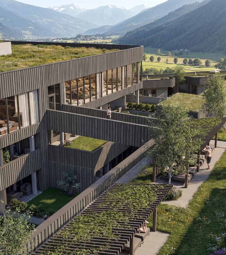 Modernes Gebäude mit begrüntem Flachdach und Pool in einer Berglandschaft