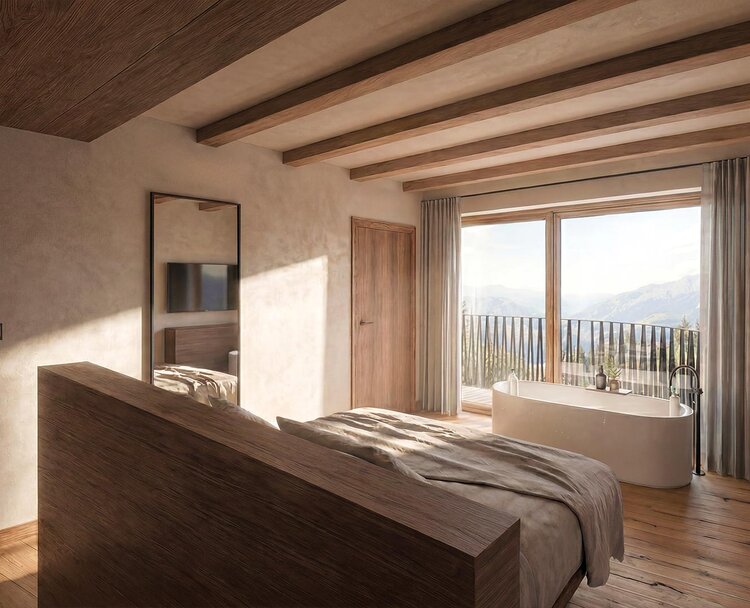 thegreen-zimmer-watersuites-2 Schlafzimmer mit großem Bett, Holzwänden und -boden, Zugang zu Balkon mit Sitzmöbeln
