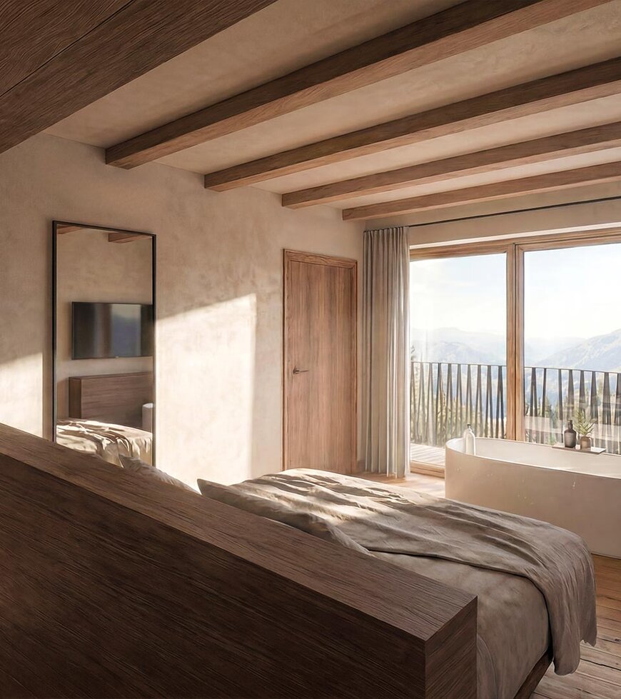 Schlafzimmer mit großem Bett, Holzwänden und -boden, Zugang zu Balkon mit Sitzmöbeln